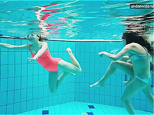 three naked gals have fun underwater